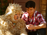 sheep and ranch hand on porch